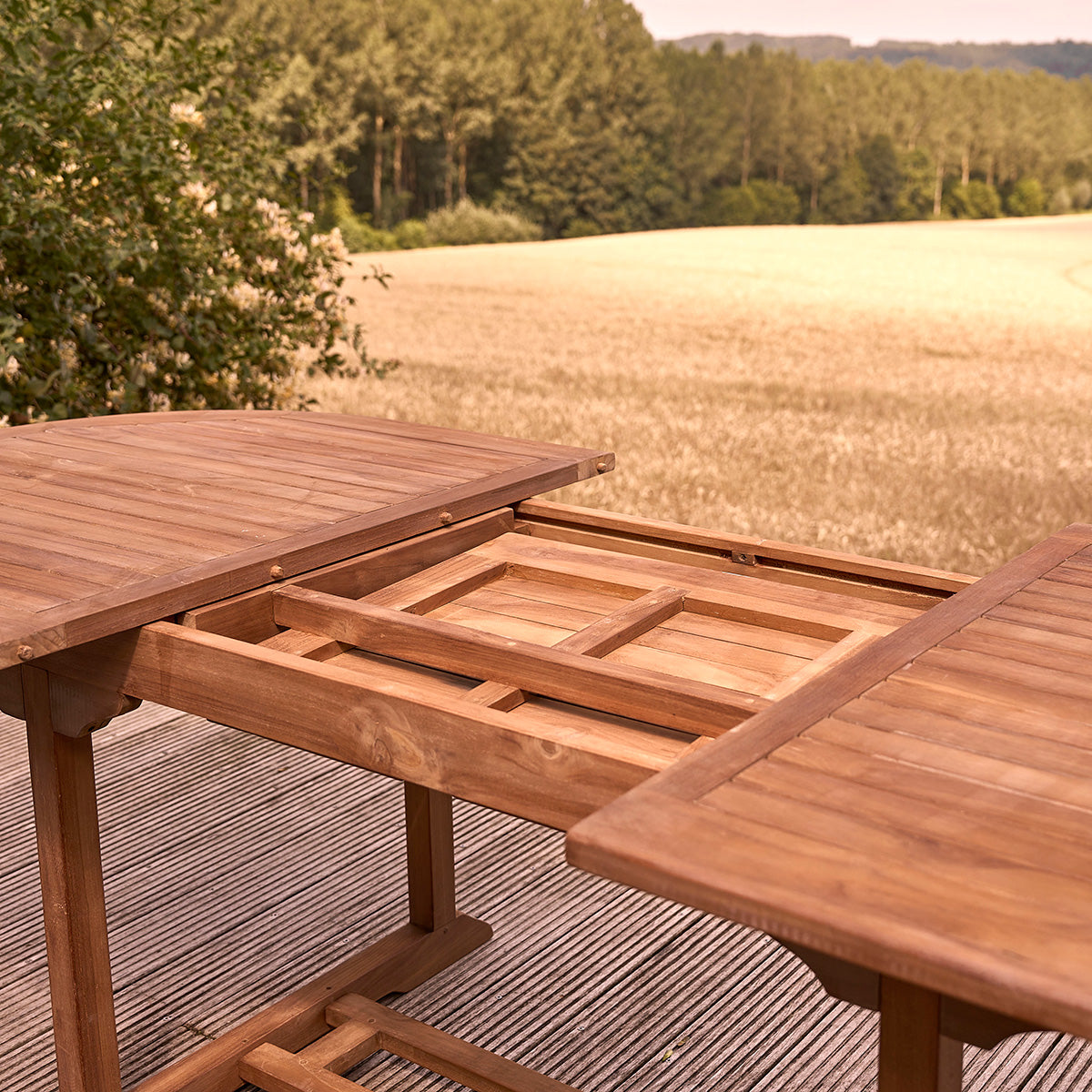 BALI - Mesa de exterior ovalada extensible de teca maciza aceitada para 8/10 pers.