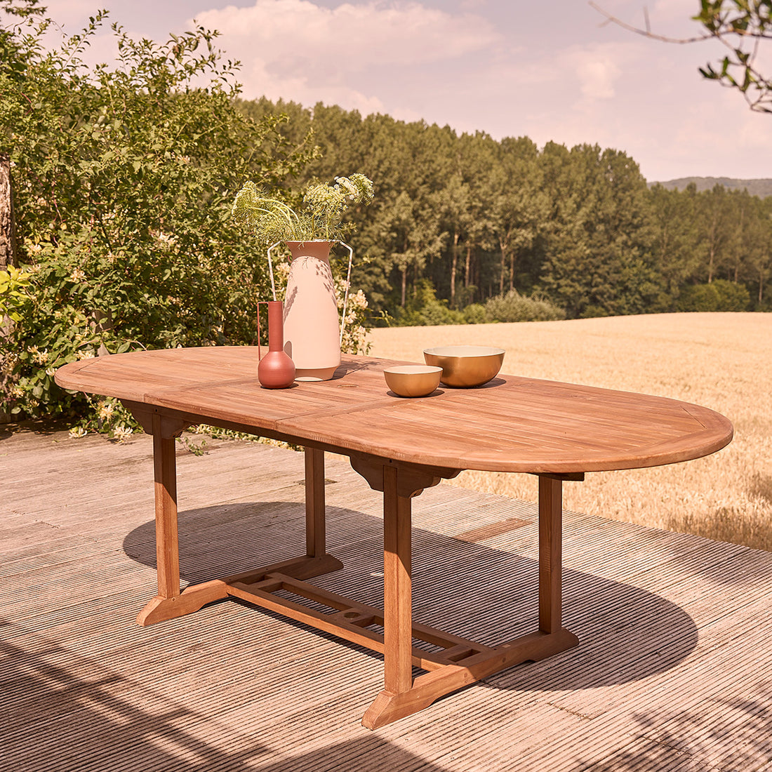 BALI - Mesa de exterior ovalada extensible de teca maciza aceitada para 8/10 pers.