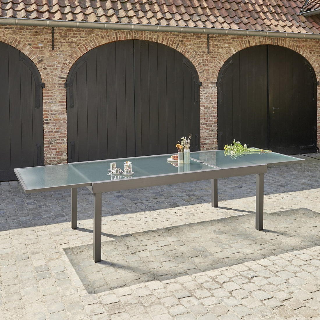 MODULO - Mesa de exterior extensible de aluminio gris para 8/12 pers. MODULO