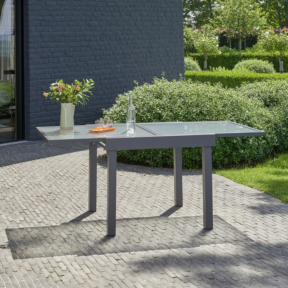 MODULO - Mesa de exterior extensible de aluminio gris para 4/8 pers. MODULO