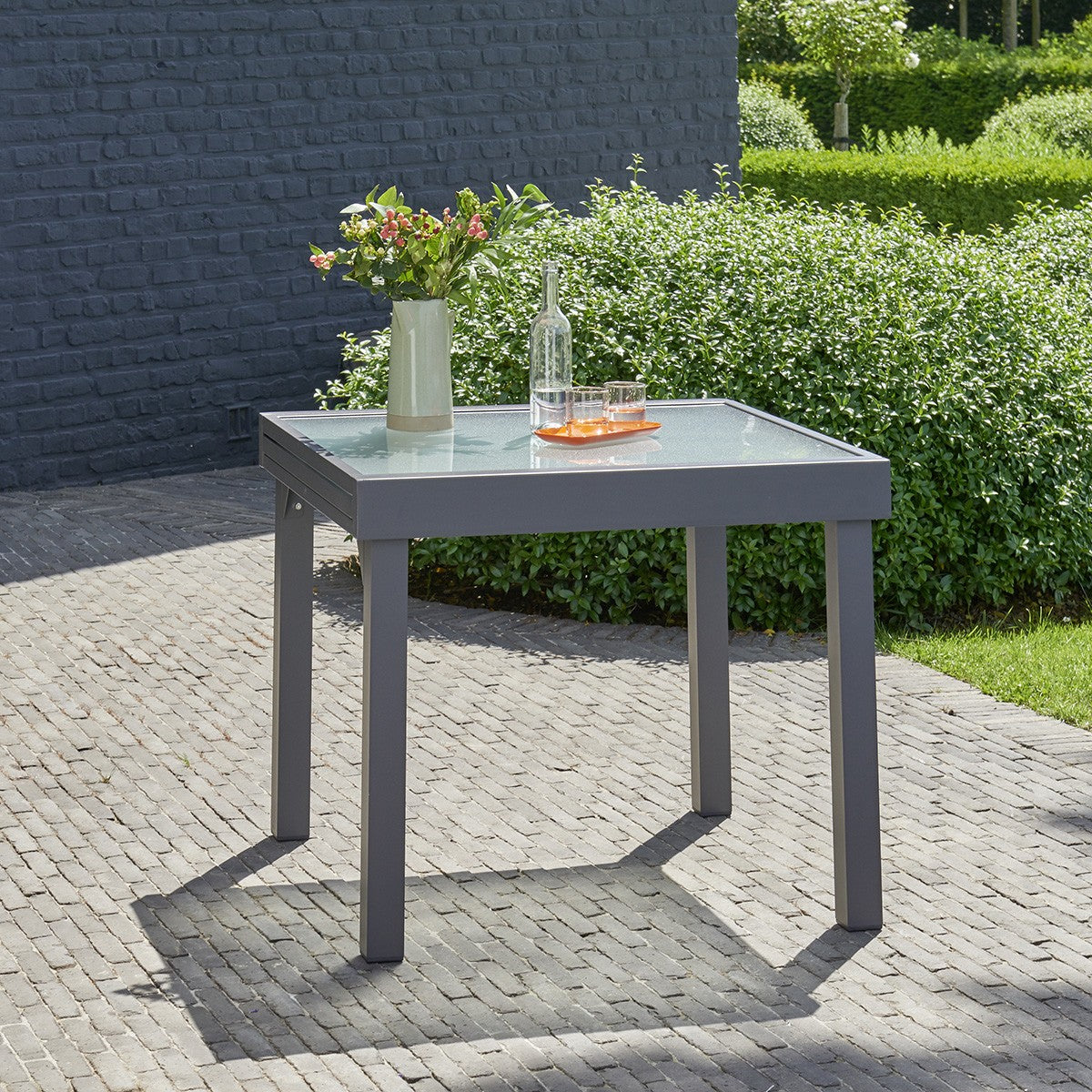 MODULO - Mesa de exterior extensible de aluminio gris para 4/8 pers.