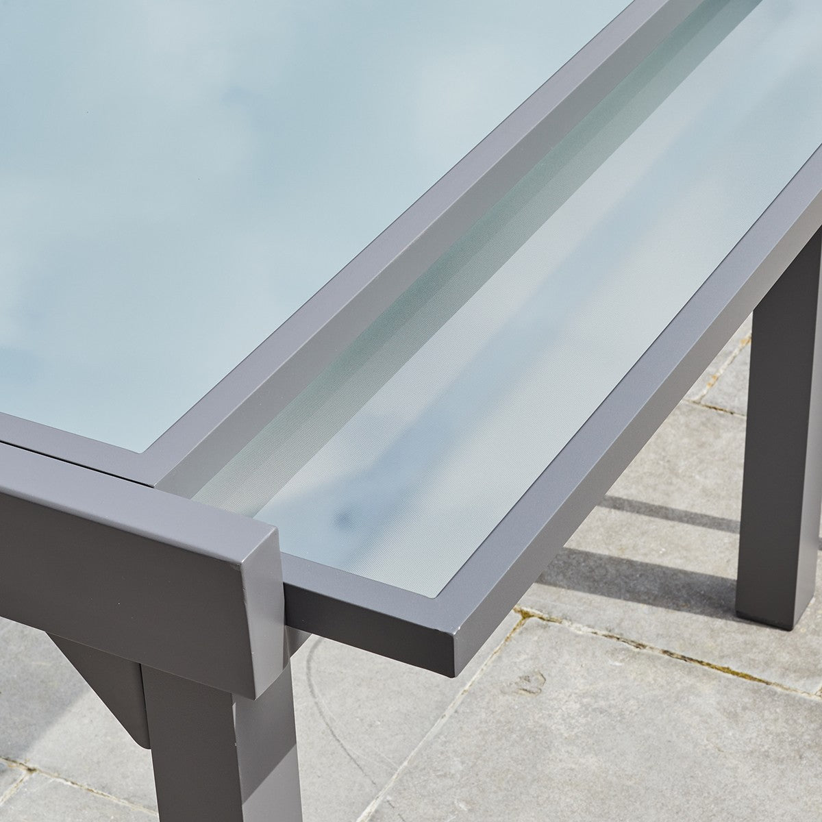 MODULO - Mesa de exterior extensible de aluminio gris para 8/12 pers.